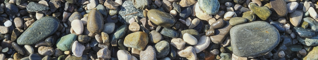 River rocks illustrating the calmness of counseling and the theme of the name of the counseling agency, Twelve Stones Counseling